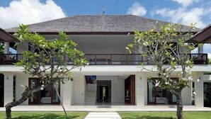 A modern two-story building with a flat roof, large windows, and a central entrance. - Villa Asante | 4BR Family Villa Near Echo Beach | Pool, Chef (Canggu)