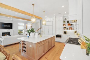 Fridge, microwave, oven, stovetop - Elegant 6-Bedroom Condo—Garage & Porch Bliss (Ocean City)