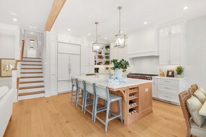 Fridge, microwave, oven, stovetop - Elegant 6-Bedroom Condo—Garage & Porch Bliss (Ocean City)