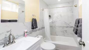 Hair dryer, towels, soap, toilet paper