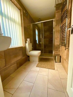Shower, hair dryer, towels, soap