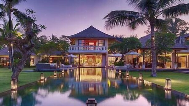 A large resort with a central building, a swimming pool, and palm trees. - Kaba Kaba Estate by Elite Havens (Tabanan)
