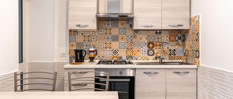 Fridge, oven, electric kettle, cookware/dishes/utensils