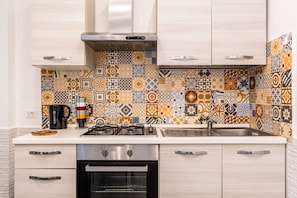 Fridge, oven, electric kettle, cookware/dishes/utensils