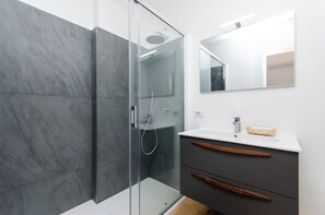 Shower, bidet, towels, soap