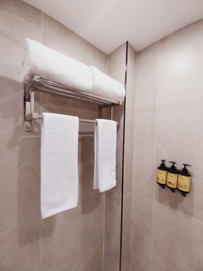 Shower, hair dryer, towels, soap