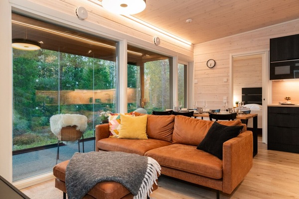 Modern Scandinavian living. Relax in our bright, open-plan lounge or enjoy a coffee on the glass-enclosed terrace.