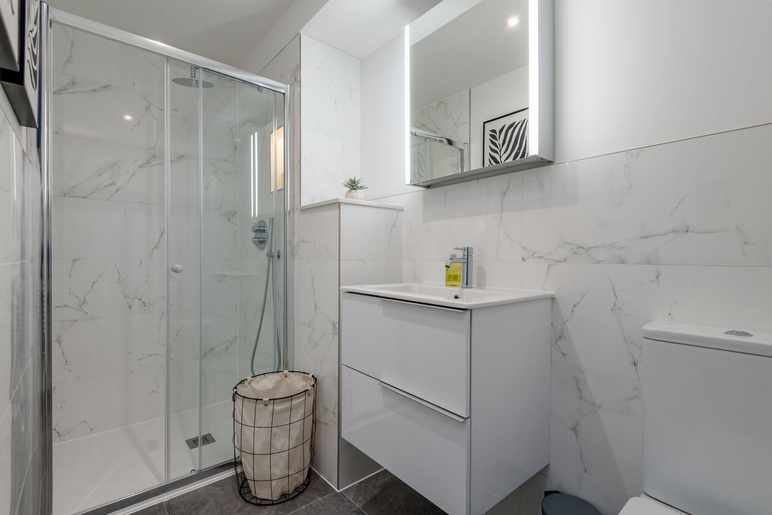 Shower, hair dryer, towels, soap