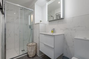 Shower, hair dryer, towels, soap