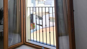 A balcony with a view of buildings and mountains. - Pepa · Serenity Apartment (Nerja)