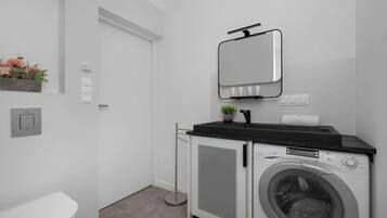 Shower, hair dryer, towels