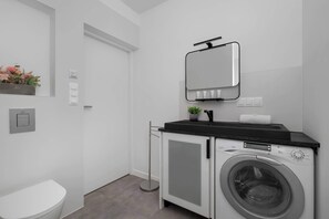 Shower, hair dryer, towels