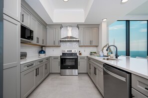 Condo, 4 Bedrooms | Private kitchen | Fridge, oven, coffee/tea maker