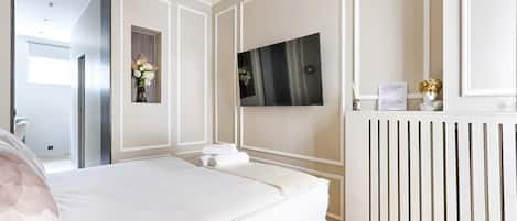 1 habitación, tabla de planchar con plancha, cuna de viaje y wifi