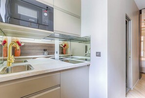 Microwave, stovetop, coffee/tea maker, toaster