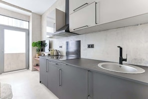 Fridge, microwave, stovetop, coffee/tea maker