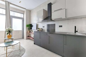 Fridge, microwave, stovetop, coffee/tea maker