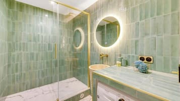 Shower, hair dryer, towels, toilet paper