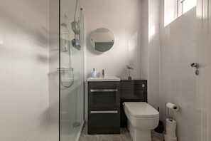 Shower, hair dryer, towels, soap