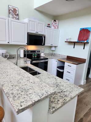 Microwave, oven, stovetop, dishwasher - Rustic Secluded Getaway – 3BR Cabin with Private Pond, Near Possum Kingdom Lake (Graford)