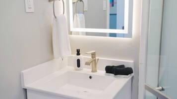 Shower, hair dryer, towels, soap