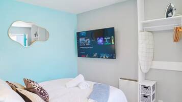 Iron/ironing board, travel crib, free WiFi, bed sheets