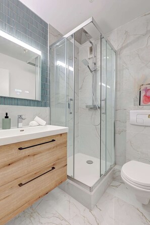 Shower, hair dryer, towels, soap