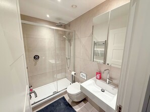 Shower, hair dryer, towels, soap