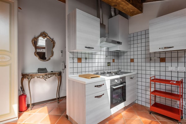 Fridge, cookware/dishes/utensils, dining tables