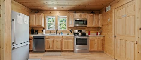 Coffee/tea maker, fridge, microwave, oven