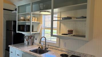 Fridge, microwave, stovetop, coffee/tea maker