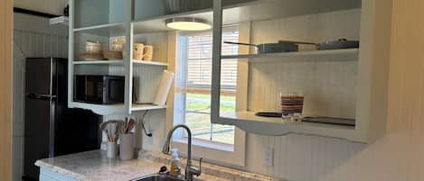 Fridge, microwave, stovetop, coffee/tea maker