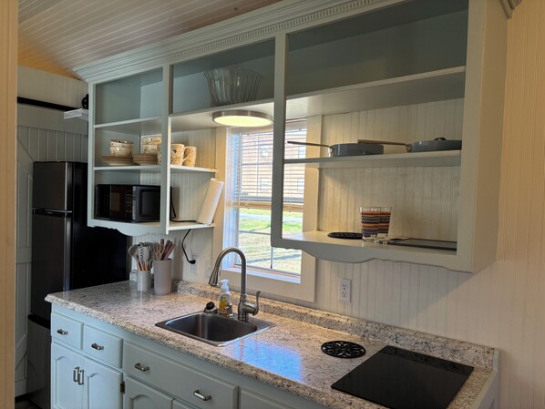 Fridge, microwave, stovetop, coffee/tea maker