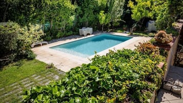 Seasonal outdoor pool, open 10:00 AM to 6:00 PM, sun loungers