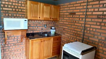 Cabin | Private kitchen | Fridge, microwave, cookware/dishes/utensils
