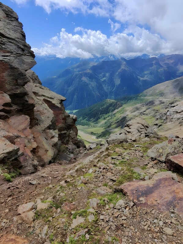 A mountainous landscape with rocky terrain and a valley.