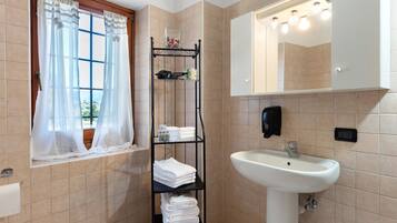 Shower, free toiletries, hair dryer, towels