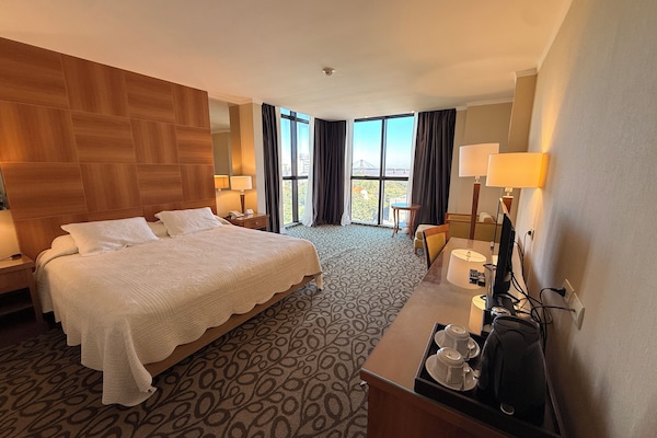 Superior Double Room, River View | Minibar, in-room safe, desk, laptop workspace