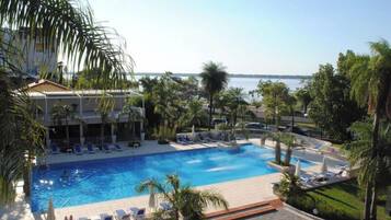 Indoor pool, outdoor pool, pool umbrellas, pool loungers