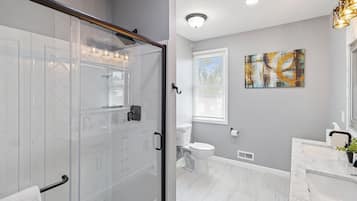 Shower, hair dryer, towels, soap