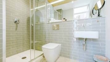 Shower, hair dryer, towels, shampoo