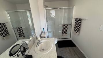 Shower, hair dryer, towels, soap