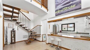 A spacious kitchen with a marble countertop, a built-in oven, and a stainless steel refrigerator. - Villa Paula - Three Bedroom Villa, Sleeps 6 (Costa Teguise)