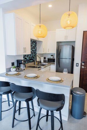 Fridge, microwave, stovetop, coffee/tea maker