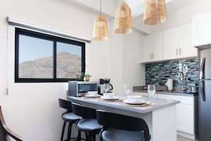 Fridge, microwave, stovetop, toaster - Vista Pedregal – Modern Vacation Apartment in Cabo San Lucas 2 min walk to Golden Zone Marina (Cabo San Lucas)