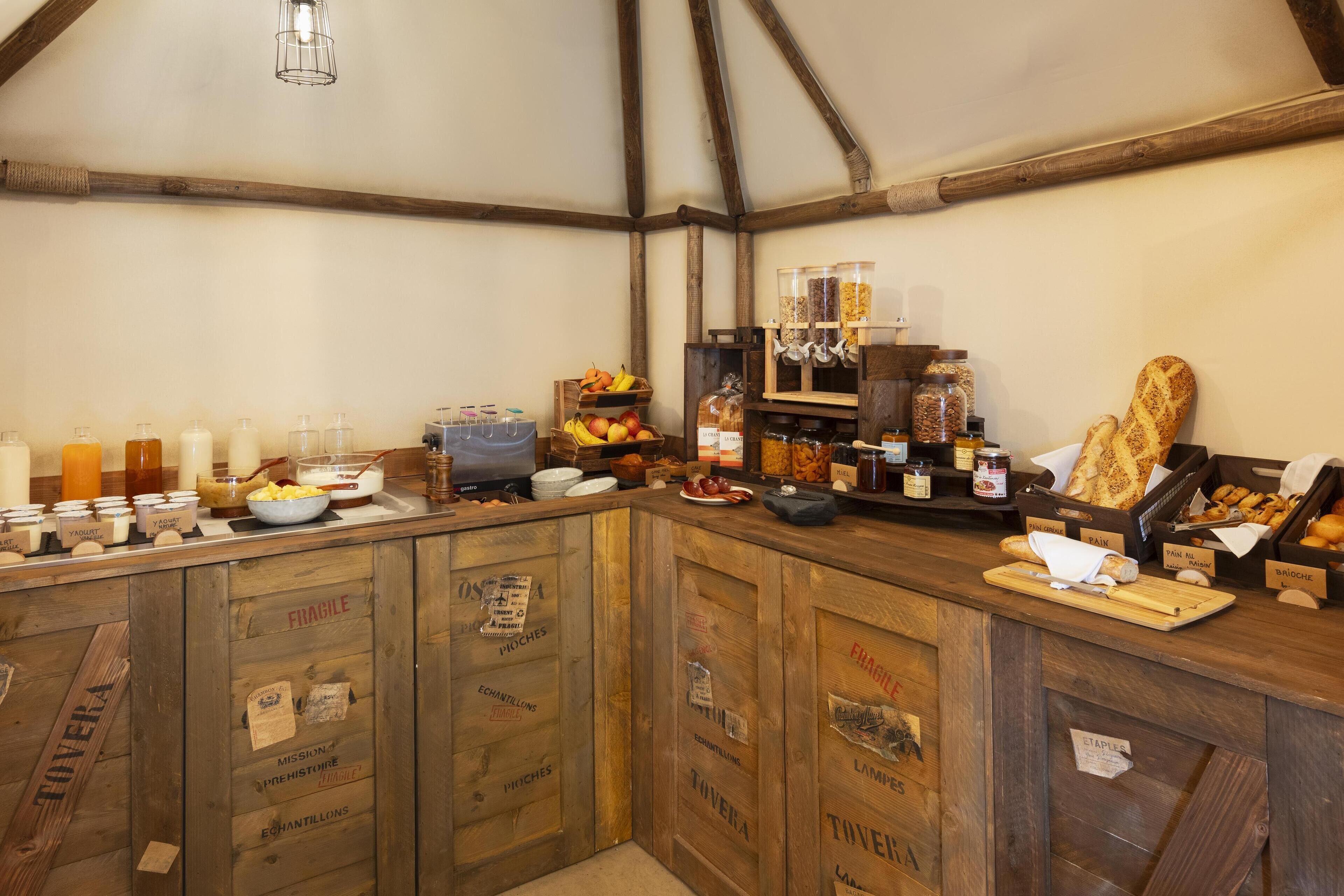 A rustic kitchen counter with various food items and condiments.