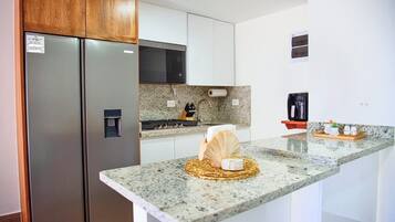 Fridge, microwave, stovetop, coffee/tea maker