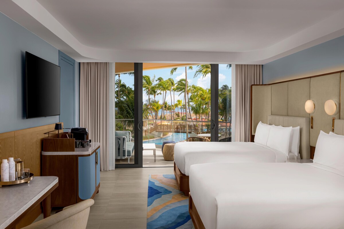 Room, 2 Queen Beds, Pool View | In-room safe, desk, iron/ironing board, bed sheets