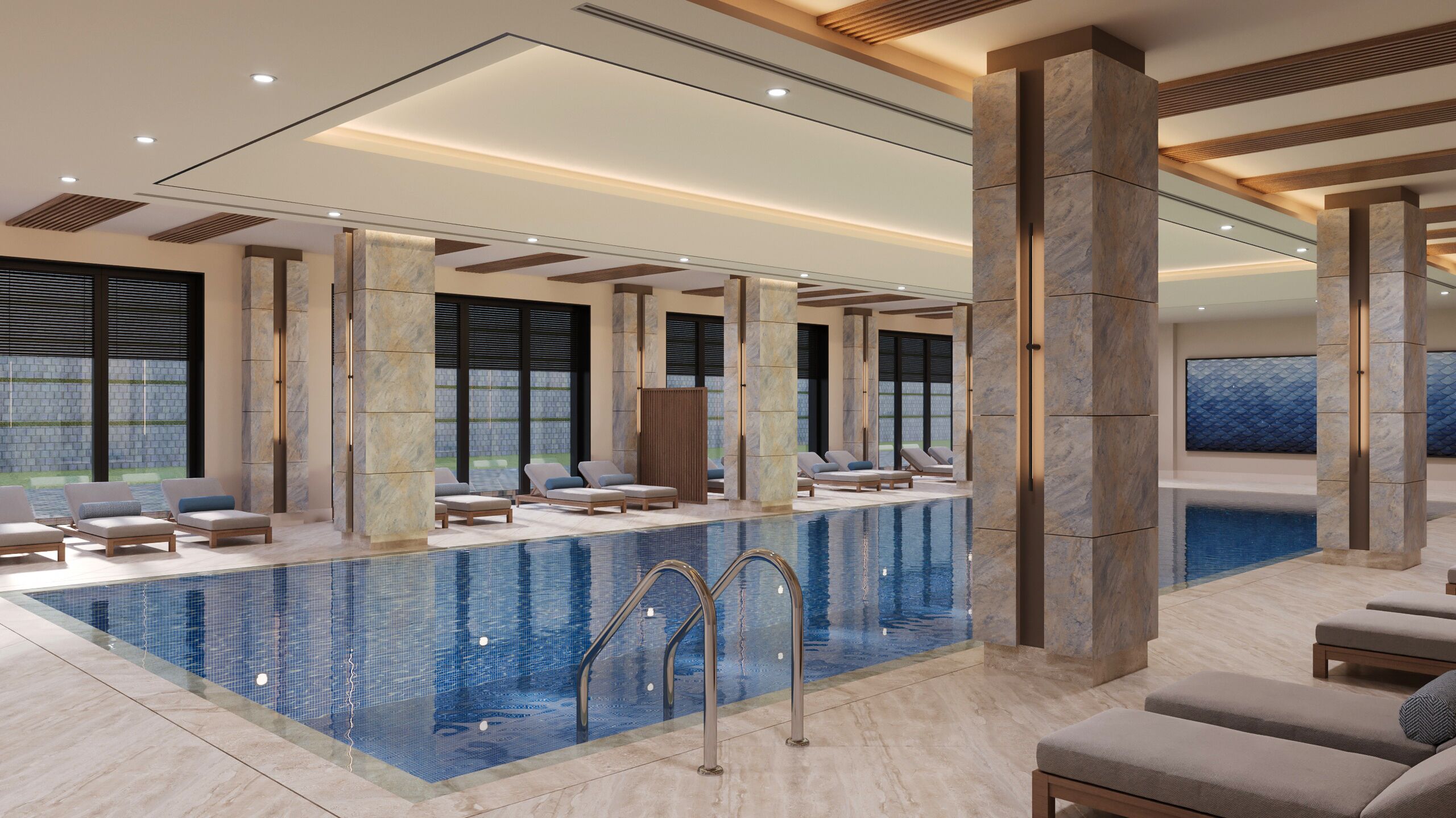 Un área de piscina interior moderna con sillones de descanso y agua cristalina.