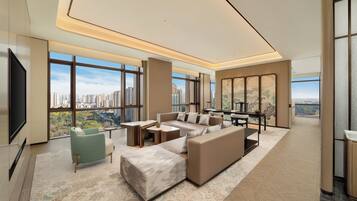 Premium Suite, 1 King Bed | Living area | 55-inch TV with cable channels